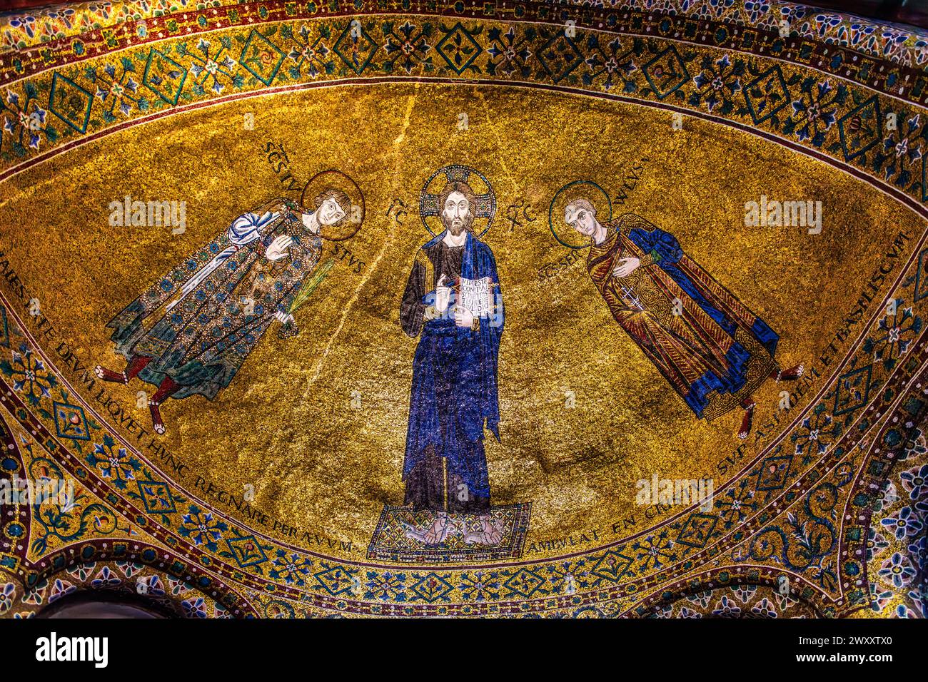 Blessing of Christ, flanked by the martyrs Giusto and Servolo, 12th century, Byzantine mosaic, left Abssis, Cathedral of San Giusto, Colle di San Stock Photo