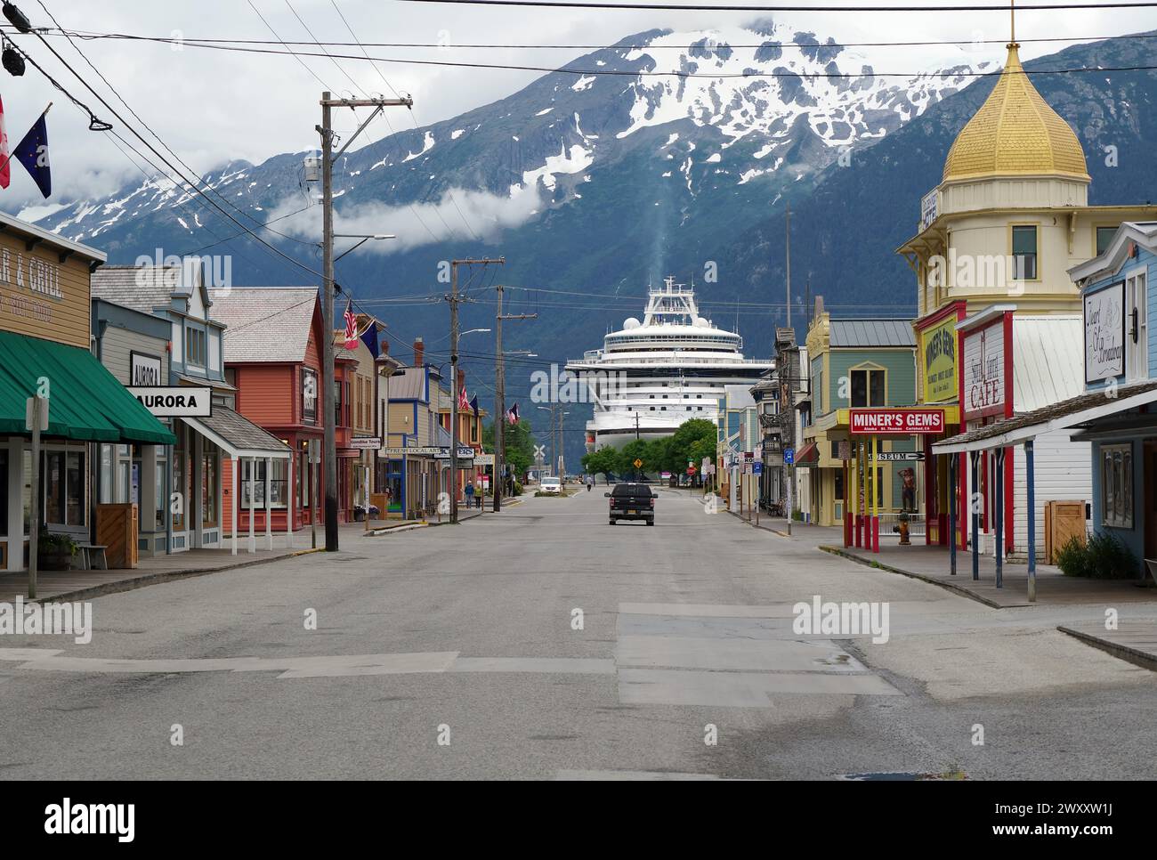Historic wooden houses and a cruise ship, Skagway, Alaska, USA Stock