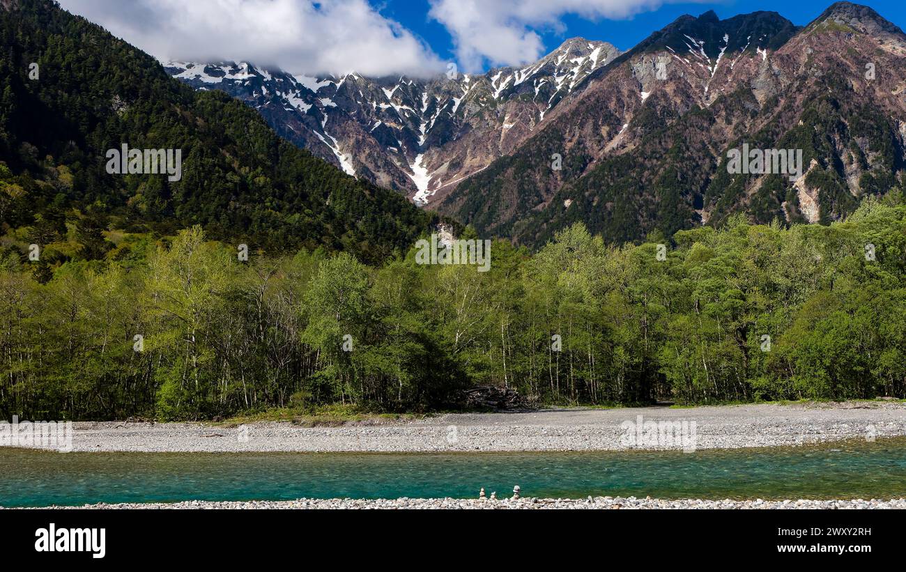 Clear, cold river running through a forested valley. River Azusa, Kamikochi, Japan Stock Photo