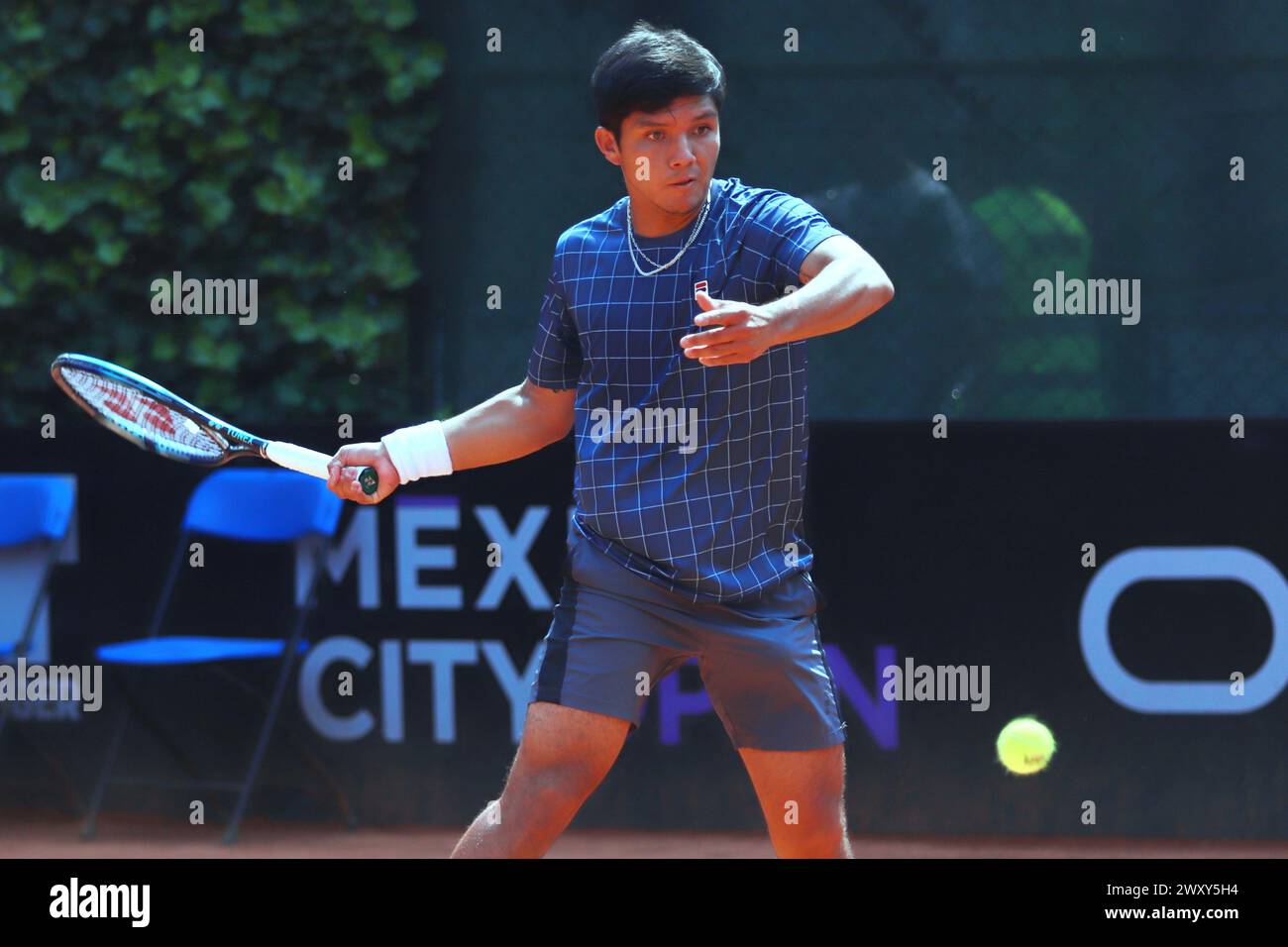 Mexico City, Mexico. 02nd Apr, 2024. Apr 2, 2024, Mexico City, Mexico: Matias Soto (CHL) hits a forehand against Giovanni Mpetshi Perricard (FRA) during the Day 3 of the Mexico City Open at Deportivo Chapultepec. on Apr 2, 2024, Mexico City, Mexico. (Photo by Carlos Santiago/Eyepix Group/Sipa USA) Credit: Sipa USA/Alamy Live News Stock Photo
