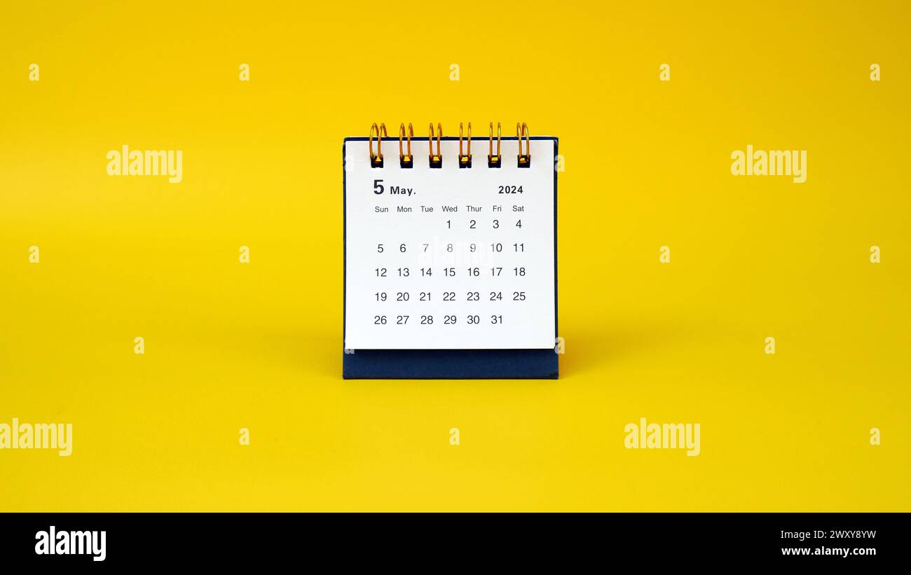 a desk calendar for May 2024 year on a yellow background. banner. space for text Stock Photo