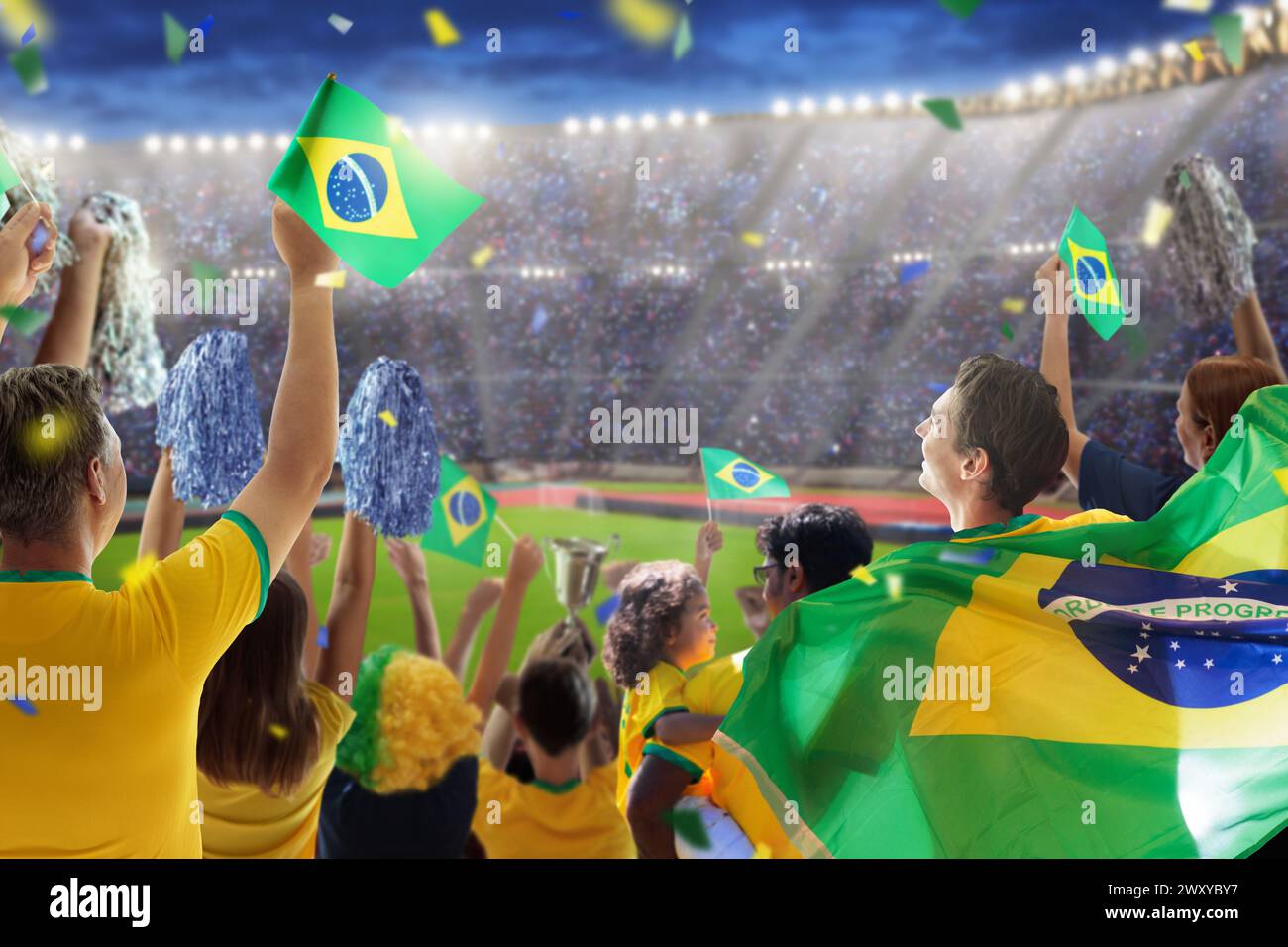 Brazil football supporter on stadium. Brazilian fans on soccer pitch watching team play. Group of supporters with flag and national jersey cheering Stock Photo