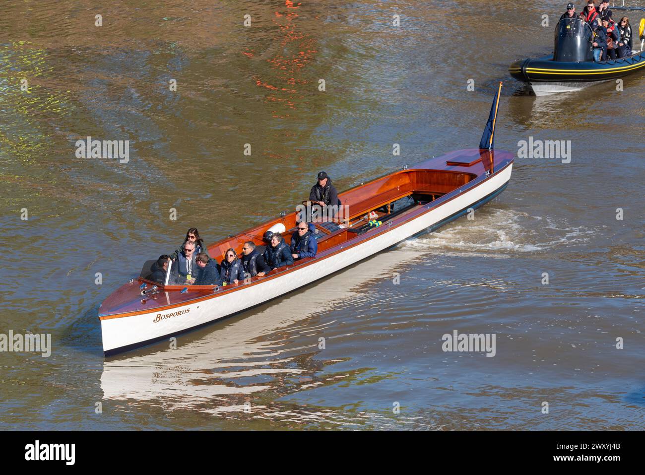 Bosporos 50' launch at the University Boat Race on the River Thames near the finish at Chiswick Bridge, London, UK. Chase boat Stock Photo