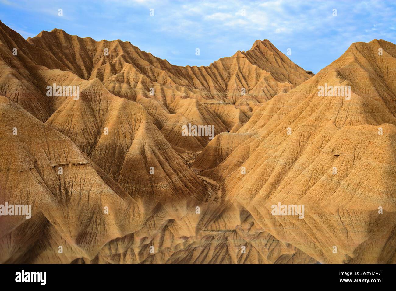 Captivating landscape of eroded badlands formations with their mirrored ...