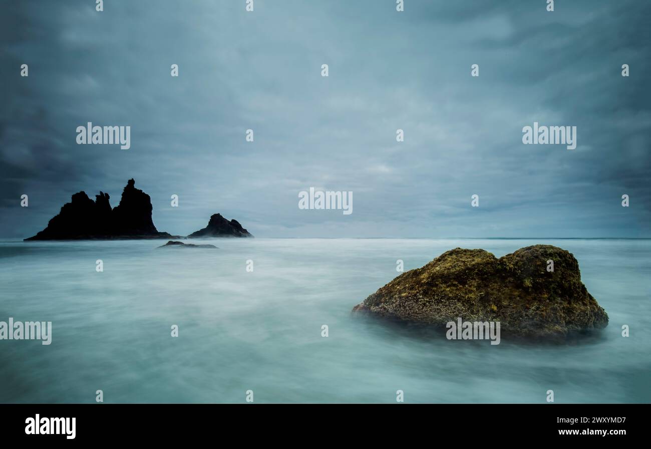 Ethereal mist envelops the rocks at Playa de Benijo under a brooding ...