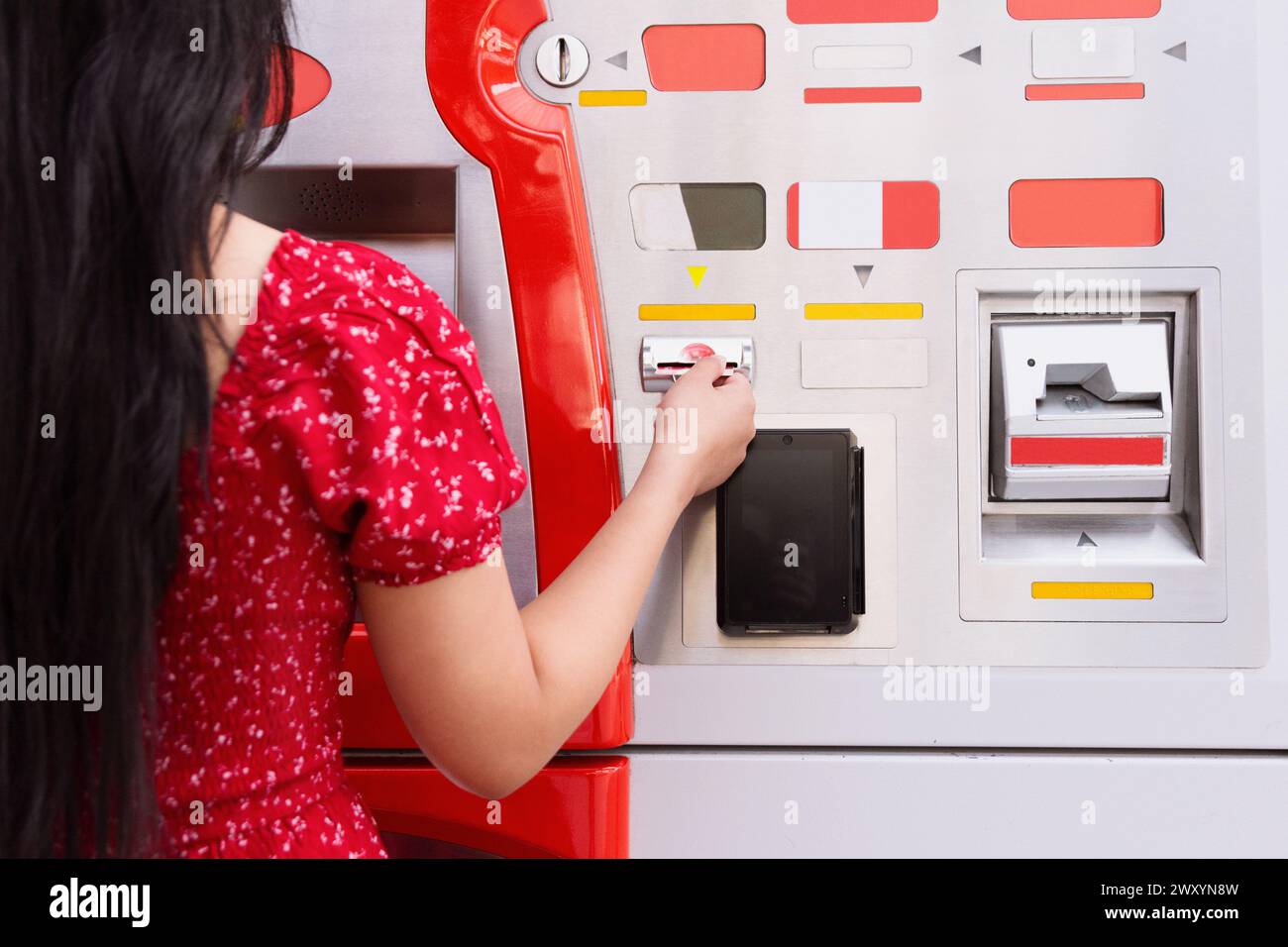 Woman seen using atm hi-res stock photography and images - Alamy