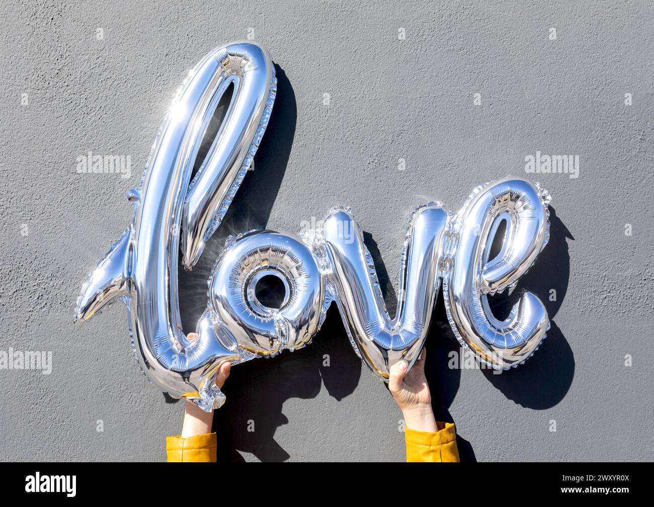 Two Fast Letters Silver balloon letters hi-res stock photography and images - Alamy
