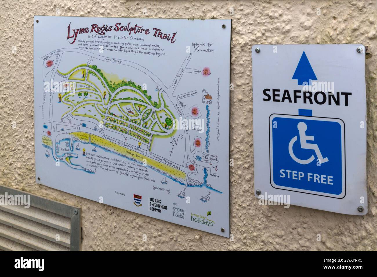 Lyme Regis Sculpture trail map sign by seafront step free sign at Lyme Regis, Dorset UK in March Stock Photo