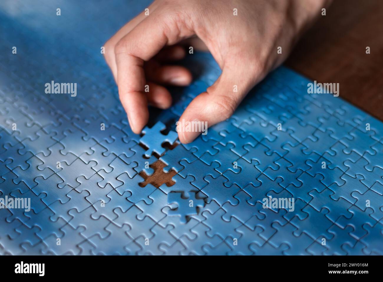 Business teamwork building big puzzle hires stock photography and