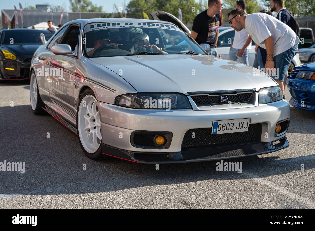 Front view of a silver Nissan Skyline GT-R33 ninth generation at a Japanese sports car meet. Stock Photo