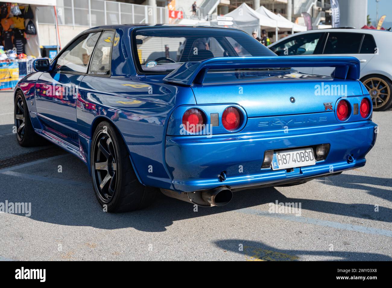 Rear view of a blue eighth-generation Nissan Skyline GT R32 at a Japanese sports car meet. Stock Photo