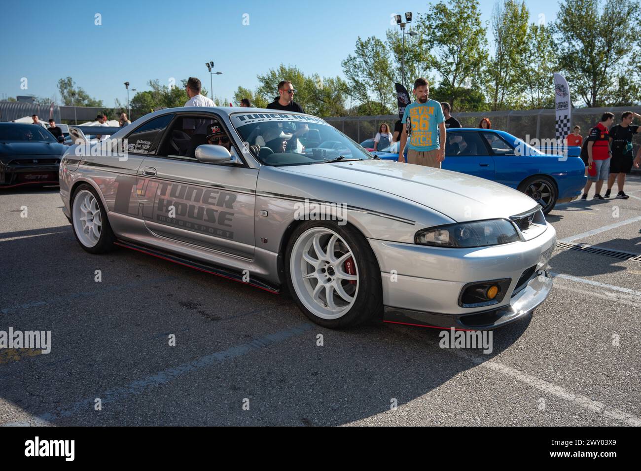 Front view of a silver Nissan Skyline GT-R33 ninth generation at a Japanese sports car meet. Stock Photo