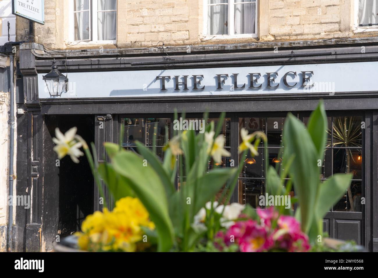 The Fleece Inn / Hotel is a pretty traditional coaching inn whose building dates back to the 17th century, Market Place, Cirencester, England. Stock Photo