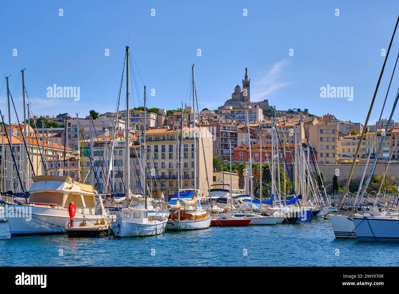 The Old Port (Vieux Port) of Marseille and Notre-Dame de la Garde on the hill-top, Provence-Alpes-Cote d'Azur, France Stock Photo