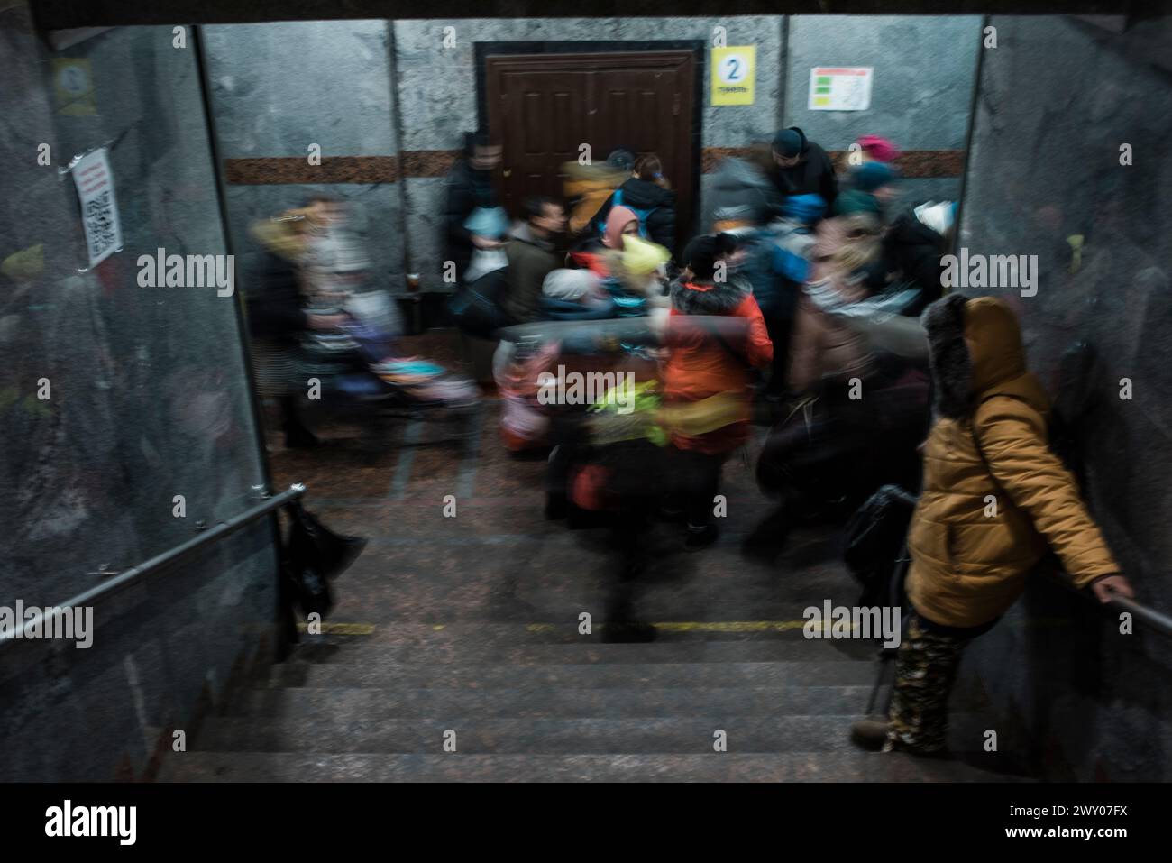 Ukrainian refugees in Lviv train station, going towards the train that embarks for Poland. Stock Photo