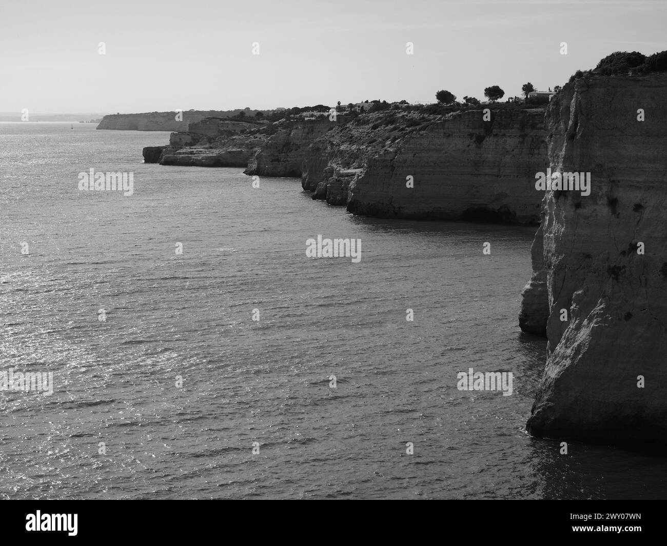 Rocky coastline on black Black and White Stock Photos & Images - Alamy
