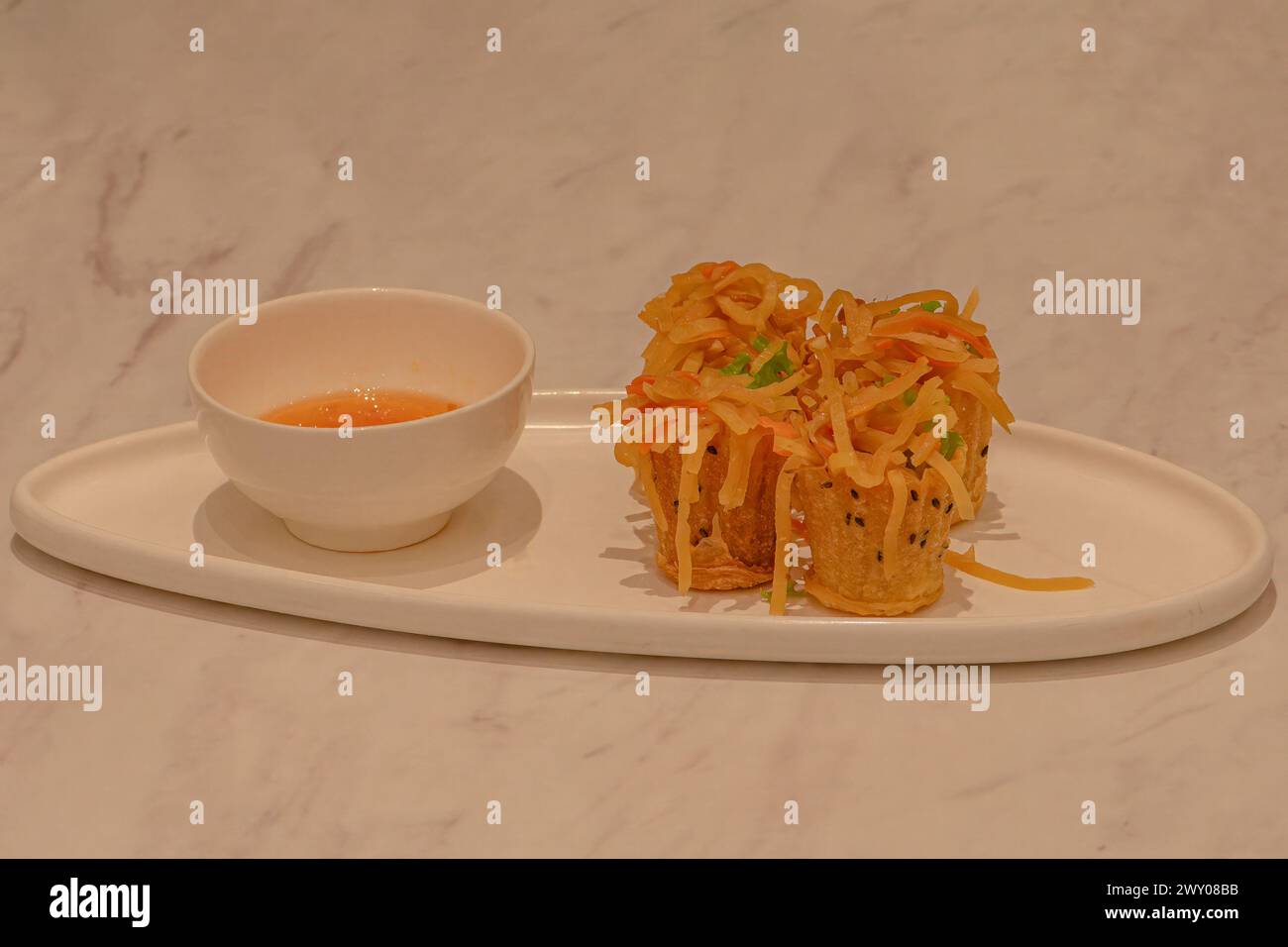 Nyonya golden little cup dessert Stock Photo