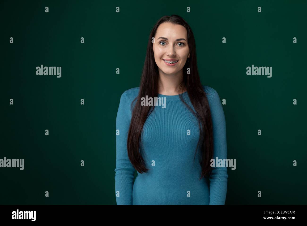 Woman in Blue Shirt Posing for Picture Stock Photo - Alamy