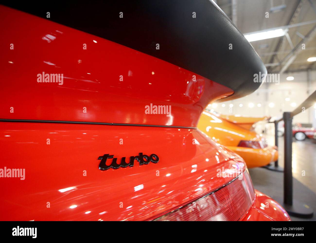 Essen, Germany. 03rd Apr, 2024. A red Porsche Turbo is exhibited at the 'Techno Classica' classic car show to mark its 50th anniversary. Techno-Classica is one of the largest classic car shows in the world. More than 2700 classic cars are on display at prices ranging from under 10,000 to several million euros. Credit: Roland Weihrauch/dpa/Alamy Live News Stock Photo
