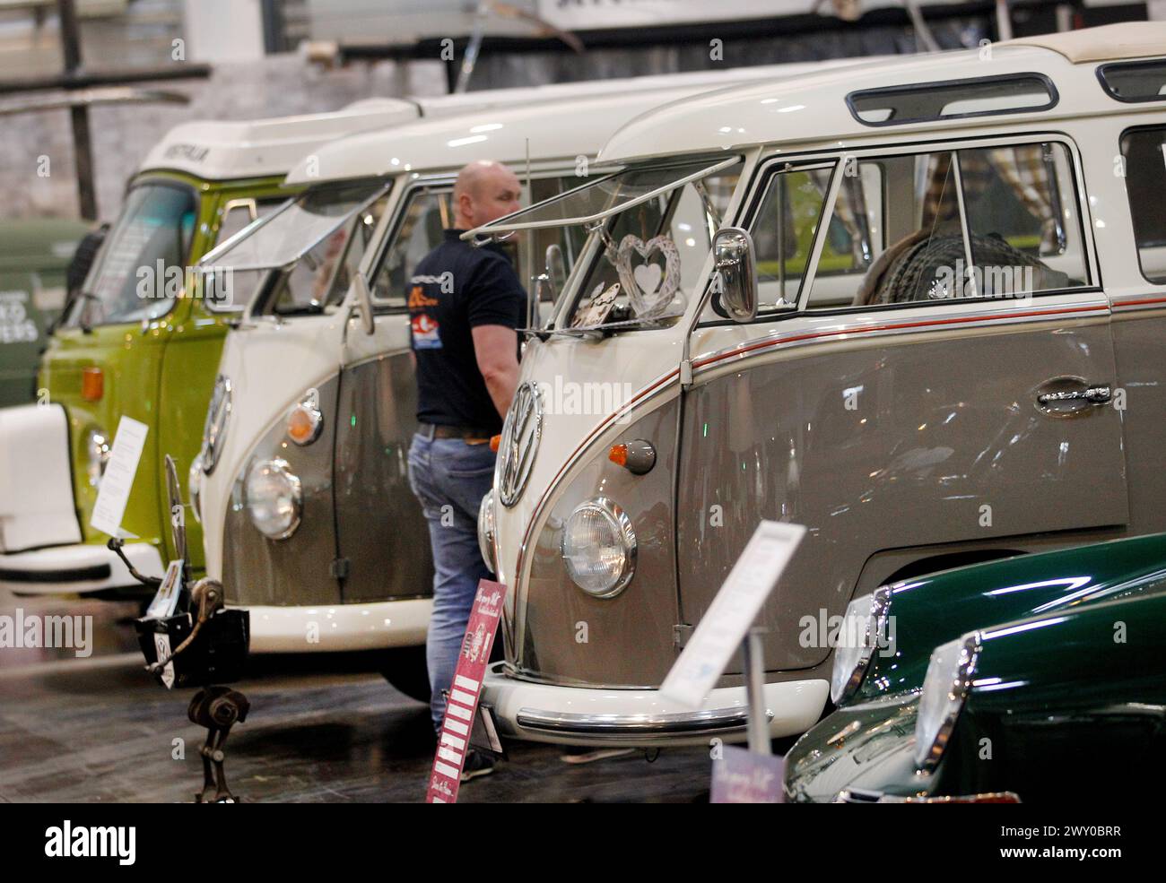Essen, Germany. 03rd Apr, 2024. VW buses, in the foreground a T-1 from 1963, are exhibited at the 'Techno Classica' classic car show. Techno-Classica is one of the largest classic car shows in the world. More than 2700 classic cars are on display at prices ranging from under 10,000 to several million euros. Credit: Roland Weihrauch/dpa/Alamy Live News Stock Photo