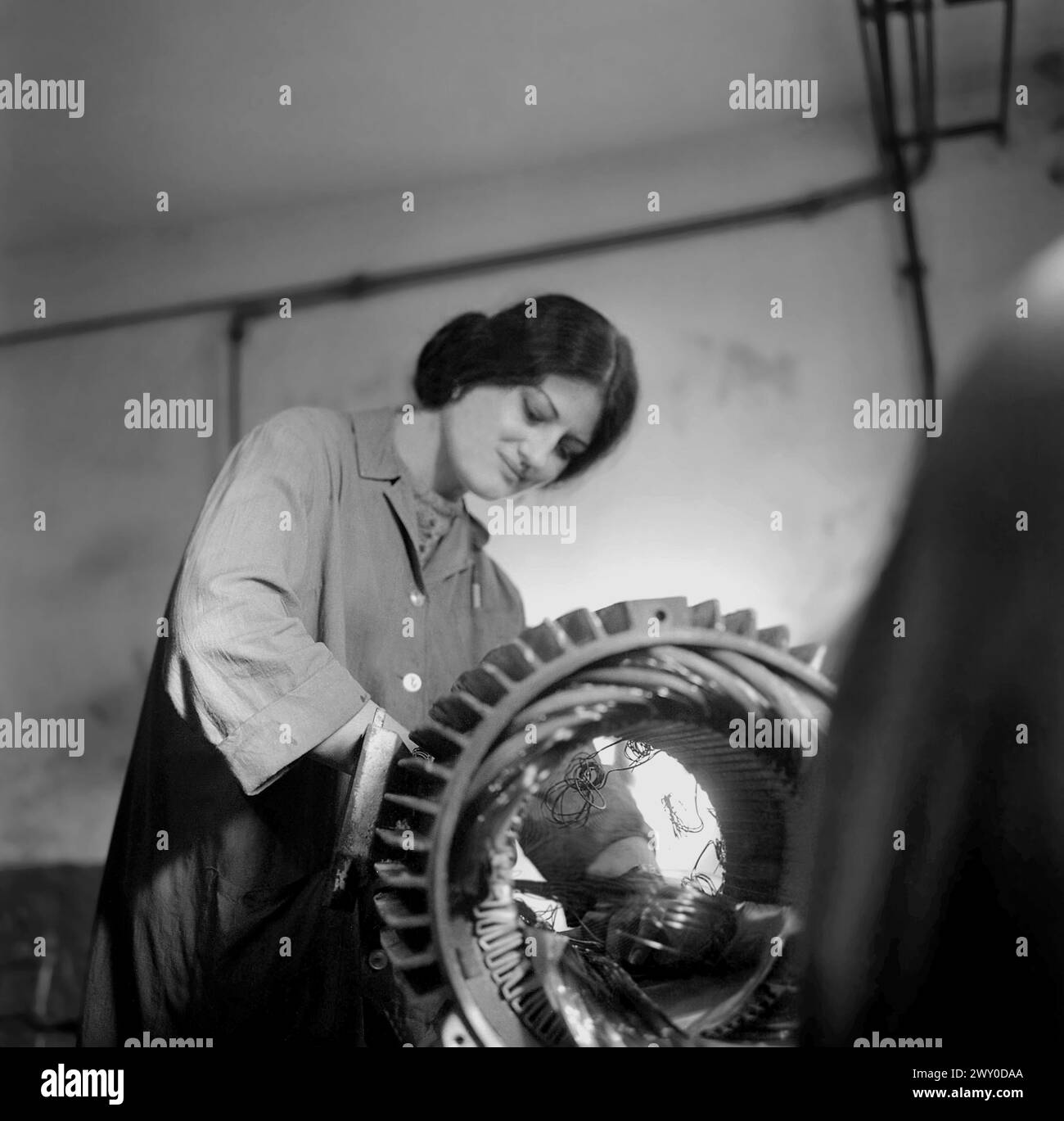 Socialist Republic of Romania in the 1970s. Woman working in a state owned factory. Stock Photo