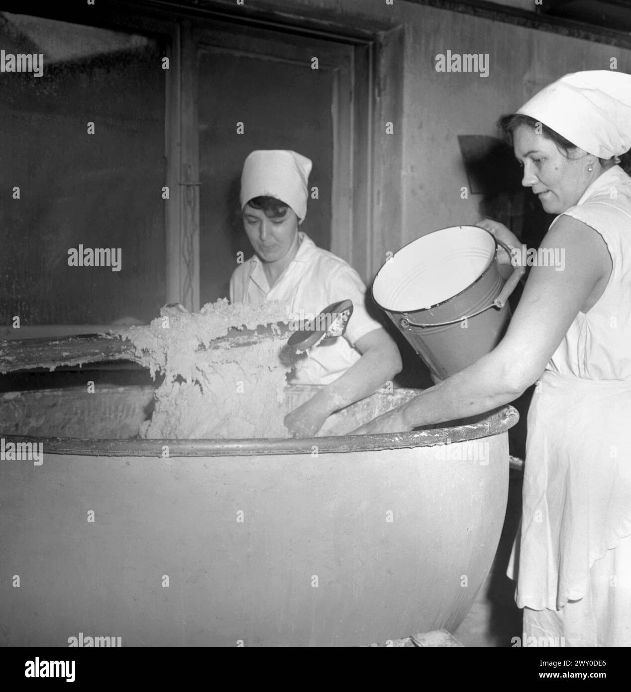 Socialist Republic of Romania in the 1970s. Workers in a state owned bread making factory. Stock Photo