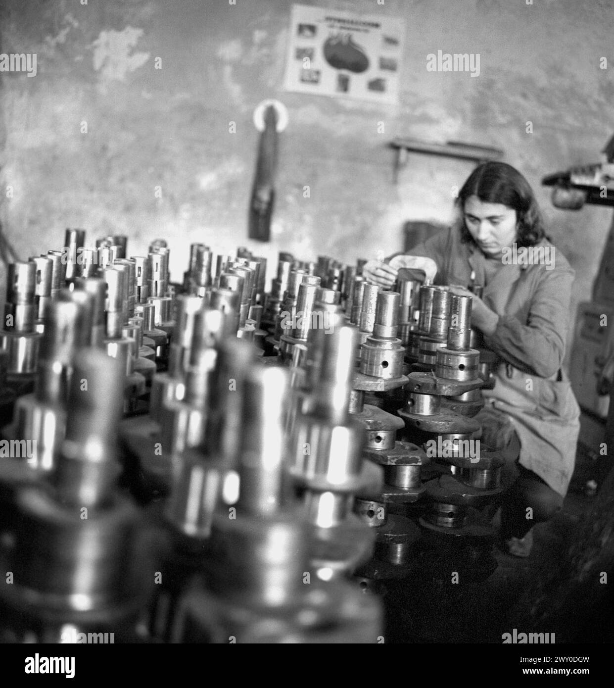 Socialist Republic of Romania in the 1970s. Woman worker in a state owned factory. Stock Photo
