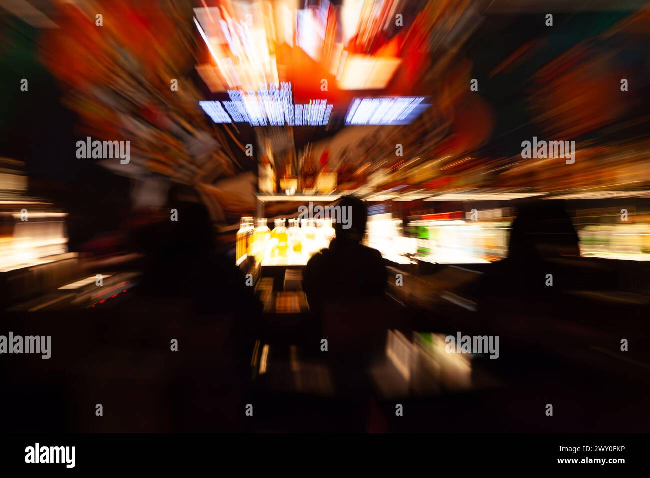 Abstract of people playing slot machines in casino Stock Photo