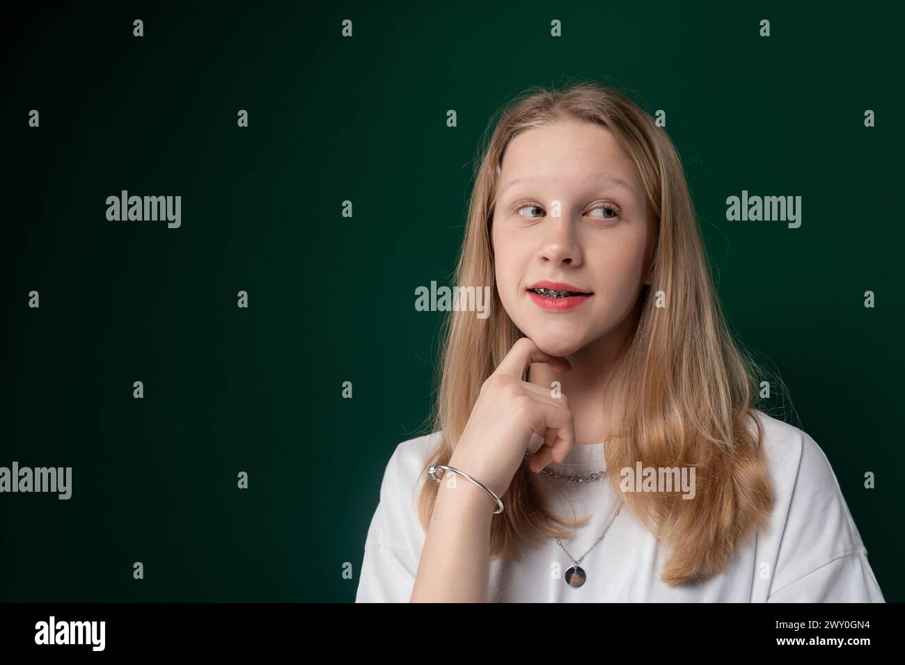 Woman in White Shirt Posing for Picture Stock Photo - Alamy
