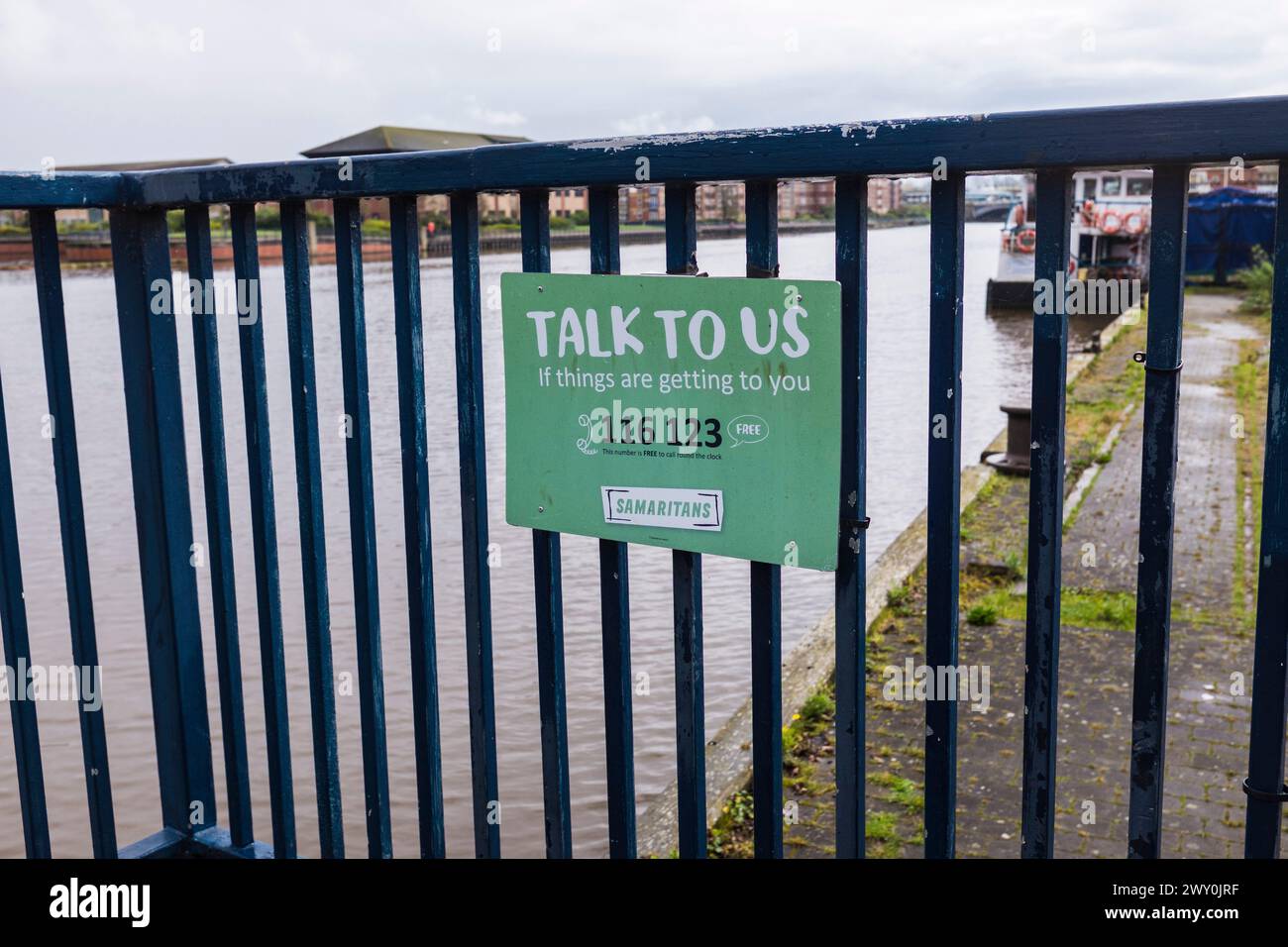 The North East of England has the highest suicide rates in England. A Samaritan notice ,with a helpline phone number next to the riverside in Stockton Stock Photo