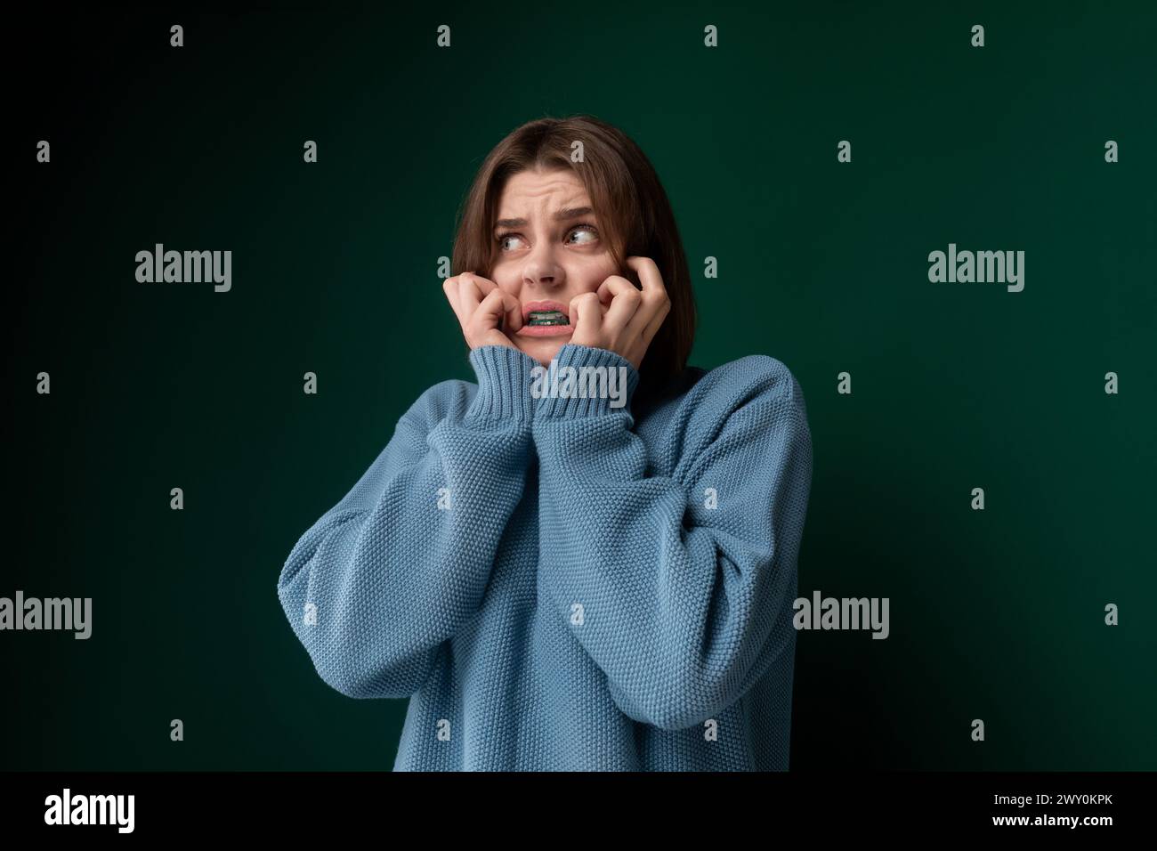 Woman Covering Her Face With Her Hands Stock Photo - Alamy