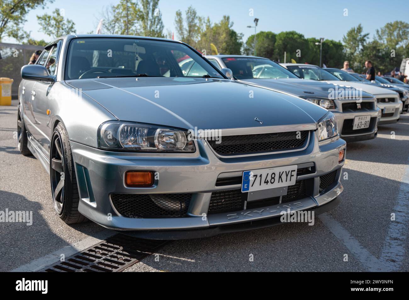 Front view of a silver tenth generation Nissan Skyline GT R34 at a Japanese car meet Stock Photo