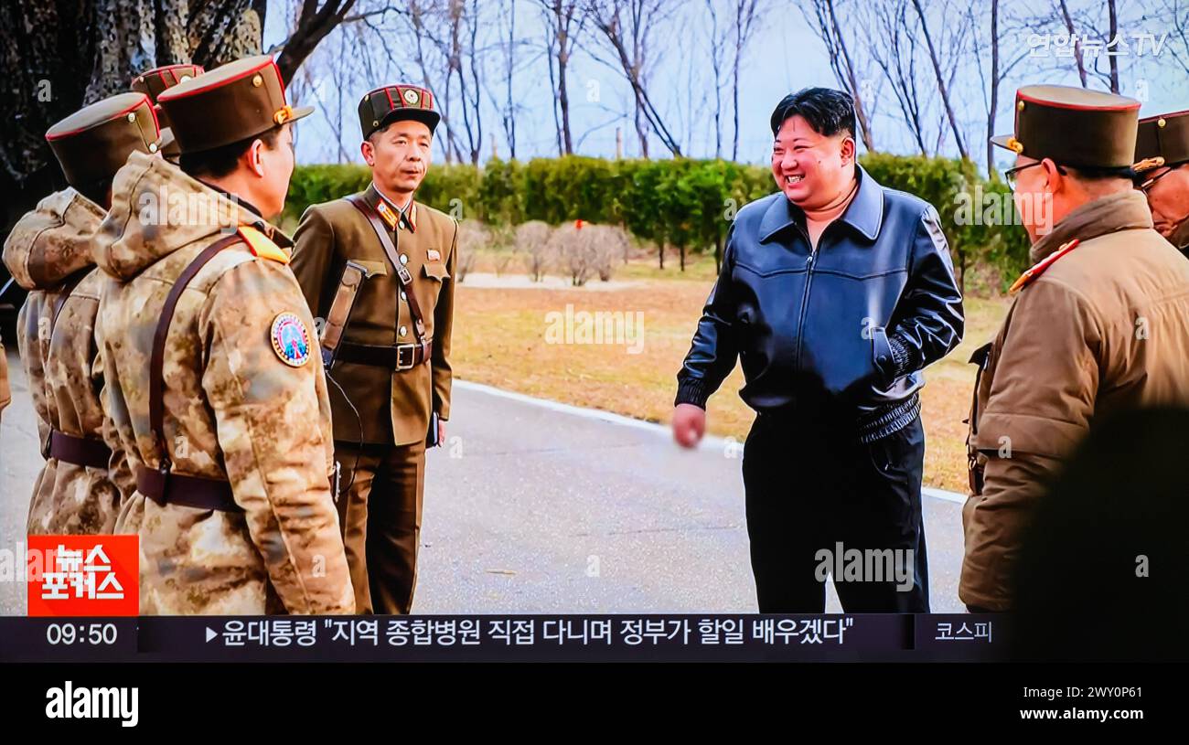 South Korea's 24-hour Yonhapnews TV shows North Korean leader Kim Jong Un(C) inspects the launch of a Hwasongpho-16B, a new type of intermediate-range solid-fueled ballistic missile equipped with a newly-developed hypersonic gliding warhead, on a TV at Yongsan Railroad Station in Seoul. North Korea said on April 3 that it successfully test-fired a new type of intermediate-range solid-fueled ballistic missile equipped with a newly-developed hypersonic glide warhead, adding that all missiles developed by the North Korea now have solid fuel and nuclear warhead control capabilities.North Korean le Stock Photo