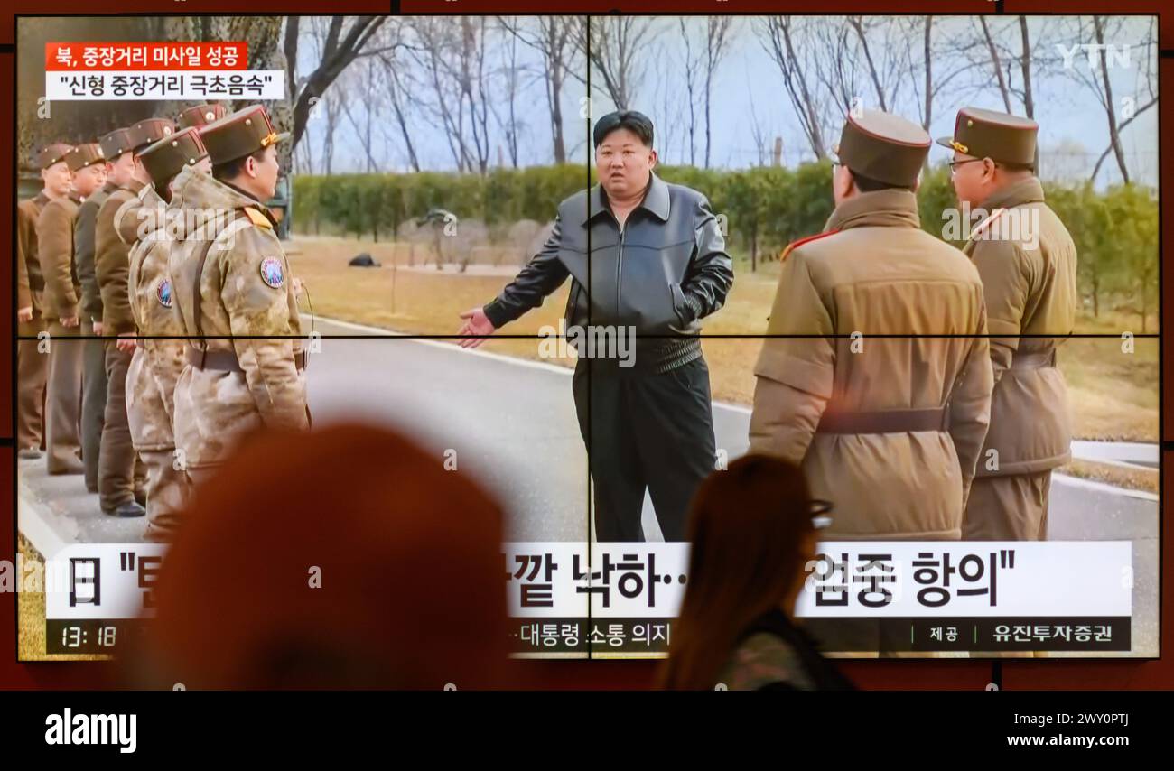 South Korea's 24-hour YTN shows North Korean leader Kim Jong Un(C) inspecting the launch of a Hwasongpho-16B, a new type of intermediate-range solid-fueled ballistic missile equipped with a newly-developed hypersonic gliding warhead, on a TV at Gangnam Express Bus Terminal in Seoul. North Korea said on April 3 that it successfully test-fired a new type of intermediate-range solid-fueled ballistic missile equipped with a newly-developed hypersonic glide warhead, adding that all missiles developed by the North Korea now have solid fuel and nuclear warhead control capabilities.North Korean leader Stock Photo