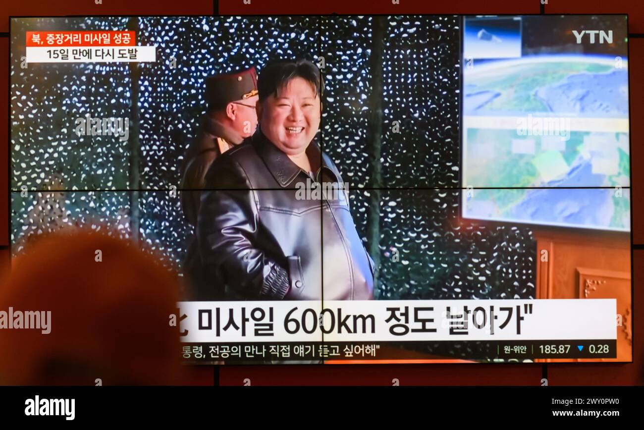 South Korea's 24-hour YTN shows North Korean leader Kim Jong Un (R) smiles while inspecting the launch of a Hwasongpho-16B, a new type of intermediate-range solid-fueled ballistic missile equipped with a newly-developed hypersonic gliding warhead, on a TV at Gangnam Express Bus Terminal in Seoul. North Korea said on April 3 that it successfully test-fired a new type of intermediate-range solid-fueled ballistic missile equipped with a newly-developed hypersonic glide warhead, adding that all missiles developed by the North Korea now have solid fuel and nuclear warhead control capabilities.North Stock Photo