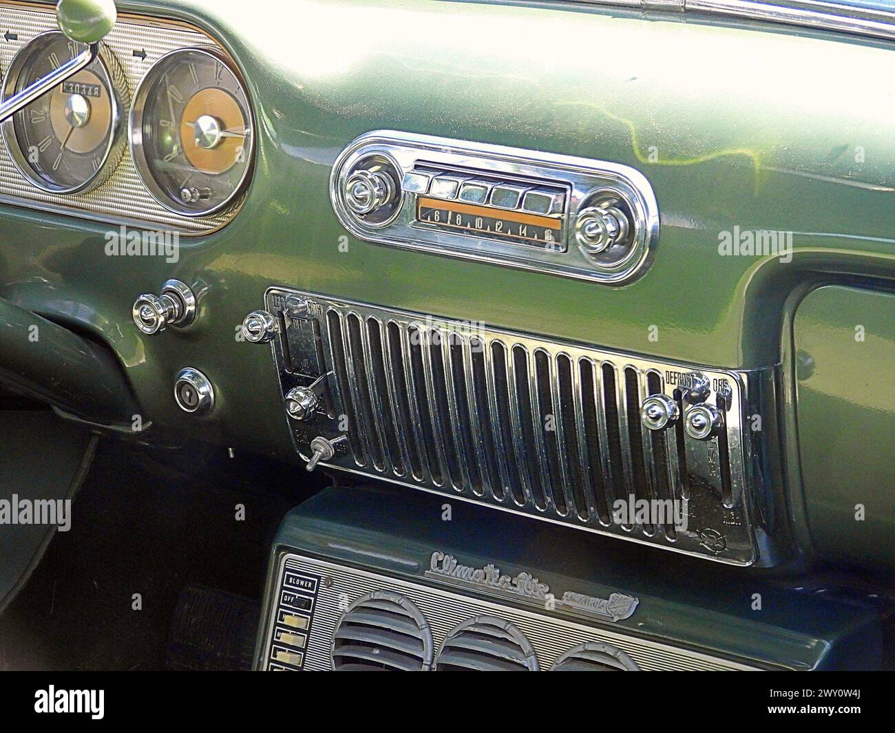 The interior and dashboard of a 1954 Packard Panama Clipper vintage car showing the air vents speedometer and dials Stock Photo