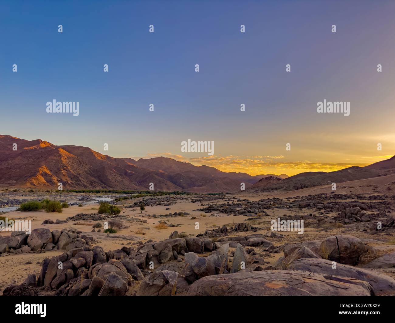 Sunrise at Tatasberg Camp Site on the Orange River in the Richtersveld National Park, arid area of South Africa Stock Photo