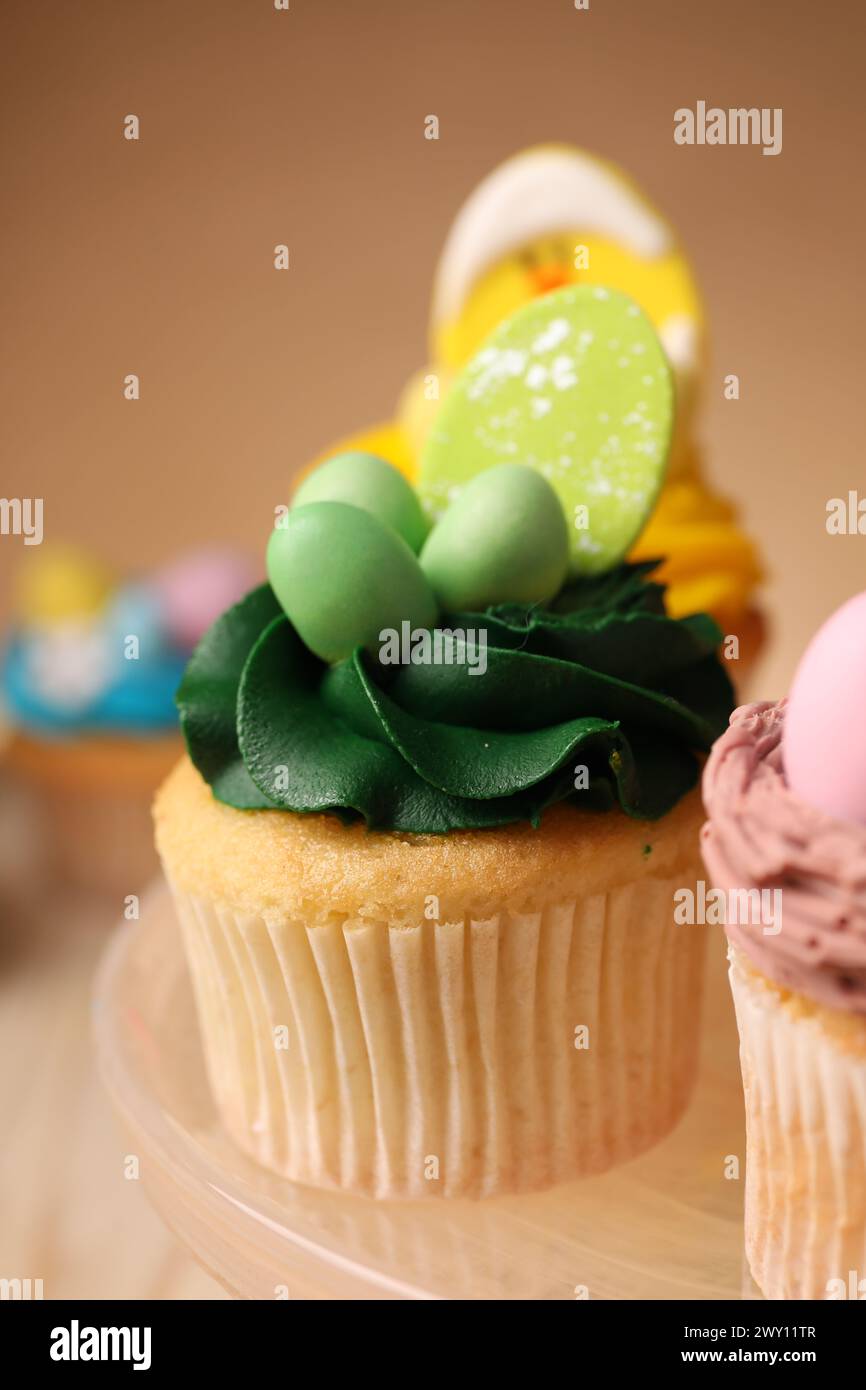 Tasty cupcake with Easter decor on stand, closeup Stock Photo
