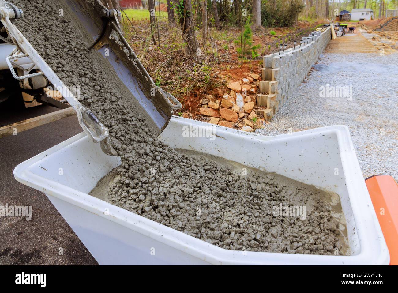 Construction site concrete buggy with wheelbarrow track wet cement in