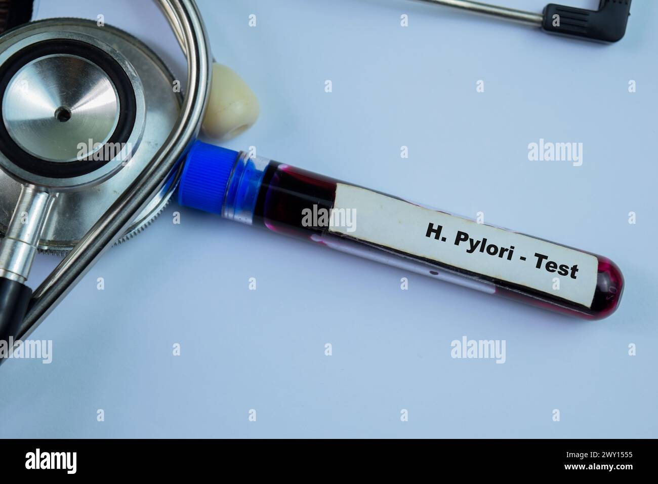 H. Pylori - Test with blood sample on wooden background. Healthcare or medical concept Stock Photo