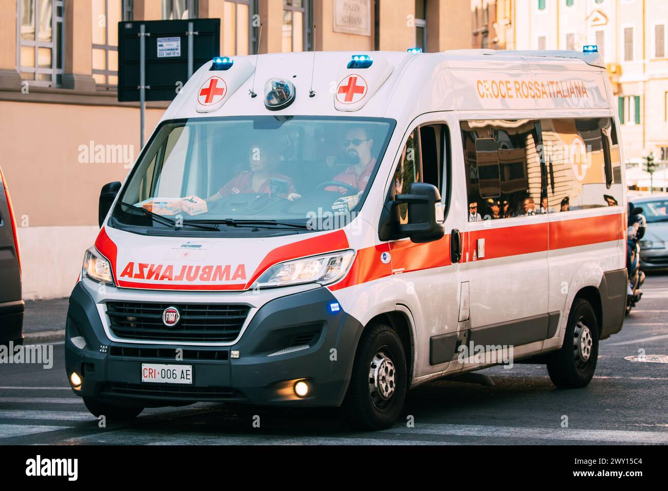 Rome, Italy. Moving With Siren Emergency Ambulance Reanimation Van Fiat Car On Street. Emergency Lights System Els Activated Stock Photo
