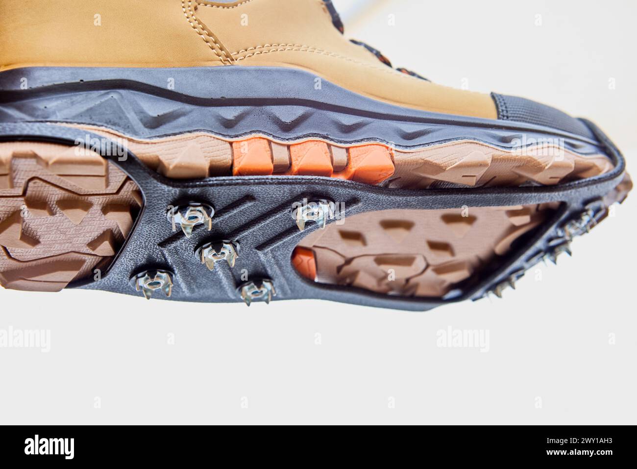 Anti-slip studded lining on sole of boots, improving traction on ...