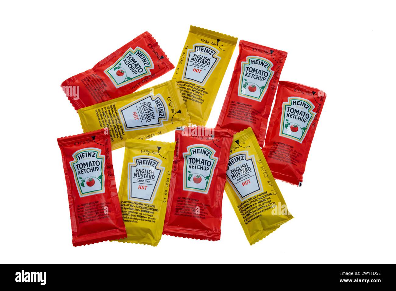 Packets of Heinz tomato ketchup and mustard on white background. Heinz brand is the most popular