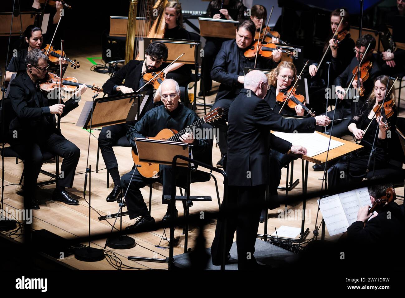 John Williams and Paul Bateman performs at the Christopher Gunning Remembered Concert on Sunday 10 March 2024 at Cadogan Hall, London. The concert featured the Royal Philharmonic Orchestra playing music by the composer with guest soloists. . Picture by Julie Edwards. Stock Photo