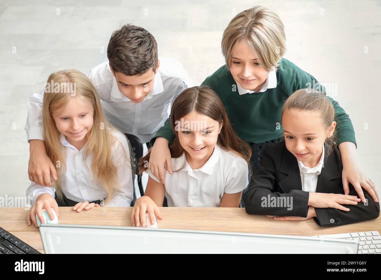 Little children studying at school computer lab Stock Photo - Alamy
