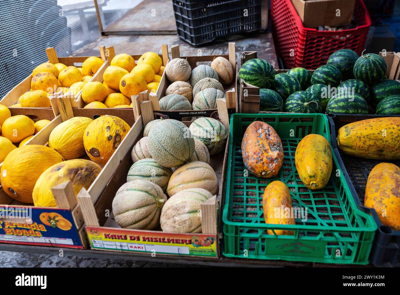 Palermo, Italy - May 13, 2023: Melons and watermelons in a fruit and vegetable shop in Ballaro Market, street food market in Palermo, Sicily, Italy Stock Photo
