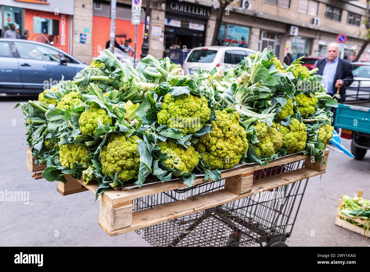Palermo, Italy - May 13, 2023: Cauliflower in a fruit and vegetable shop in Ballaro Market, street food market with people around in Palermo, Sicily, Stock Photo