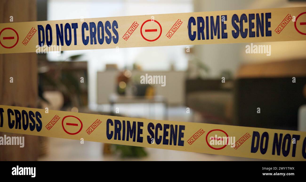 Crime scene, tape and evidence in house for case, inspection and investigation in living room. Apartment, home and lounge with warning from police Stock Photo