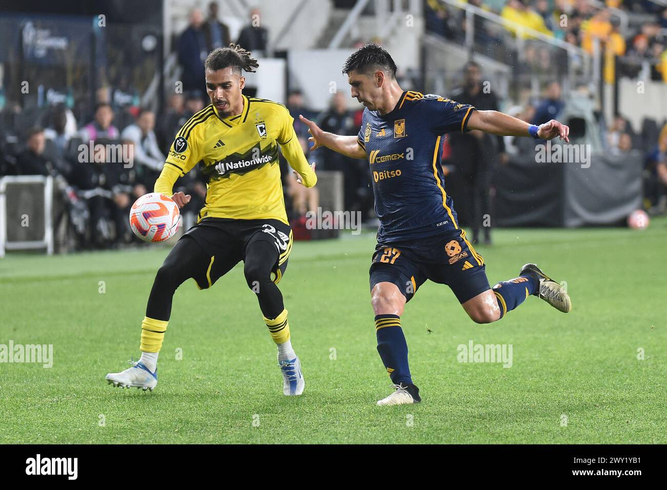 Columbus, Ohio, USA. 2nd Apr, 2024. Columbus Crew defender Mohamed Farsi (23) handles the ball against Tigres UANL defender JesÃºs Angulo (27) in their match in Columbus, Ohio in their match in Columbus, Ohio. Brent Clark/Cal Sport Media/Alamy Live News Stock Photo