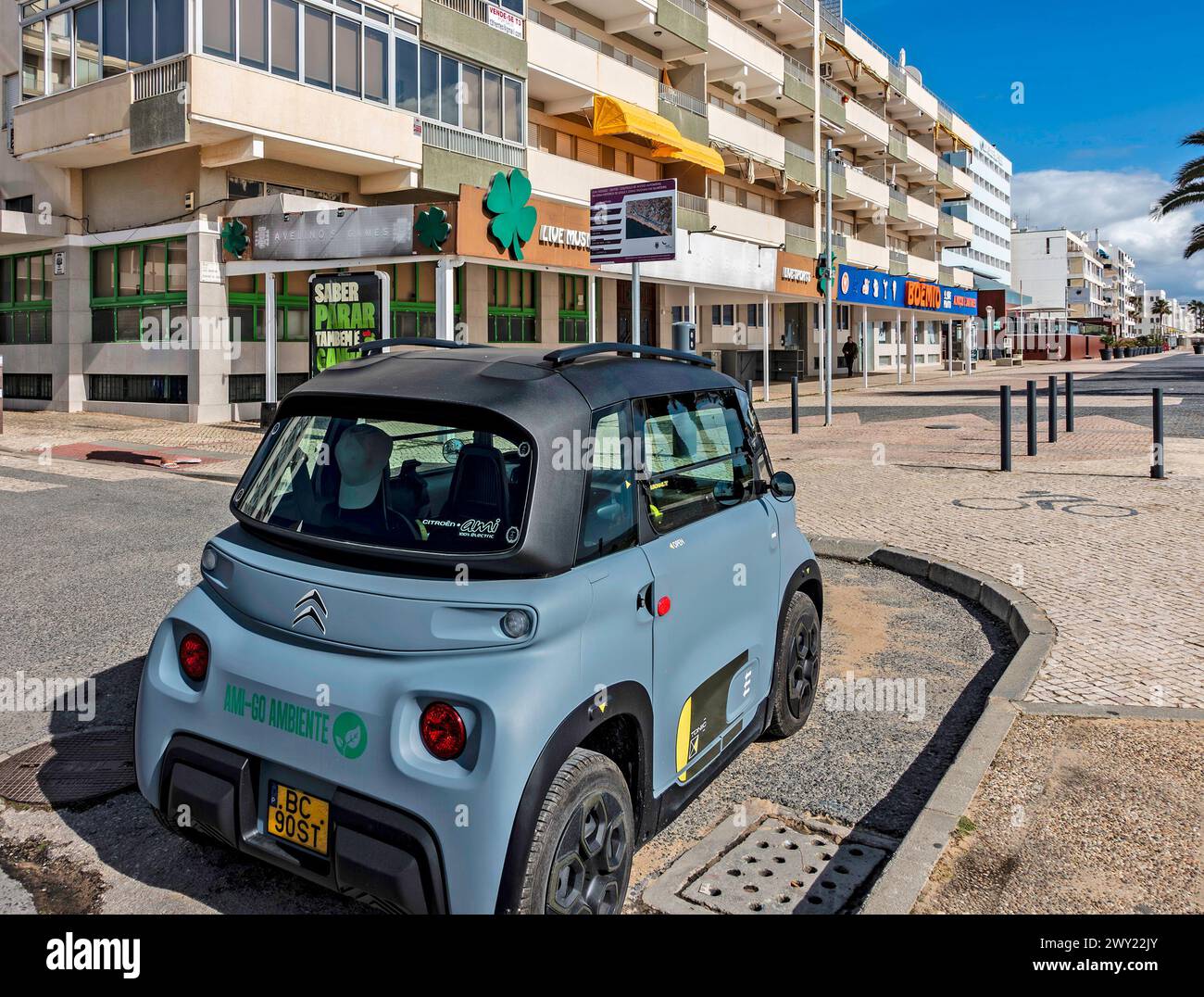 A Citroen Ami, electric, two seater car, parked here in Quarteira, Portugal. Stock Photo